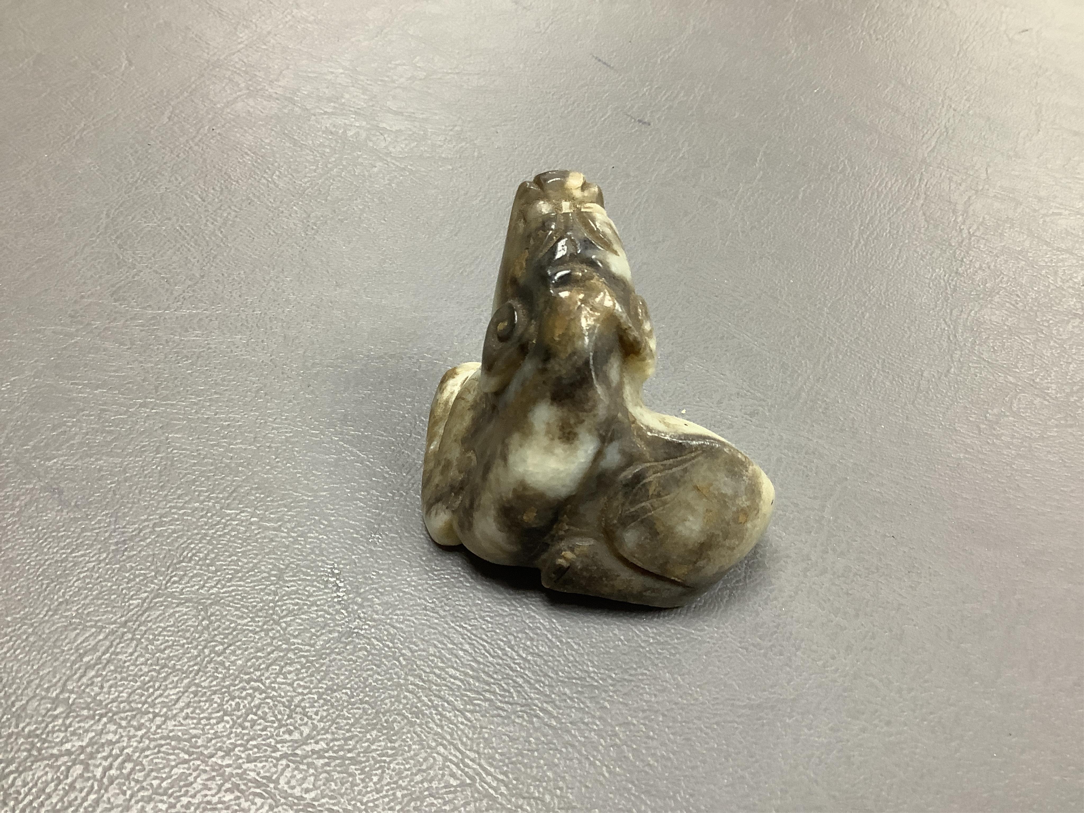 A Chinese white and black jade mythical beast, 5cm wide